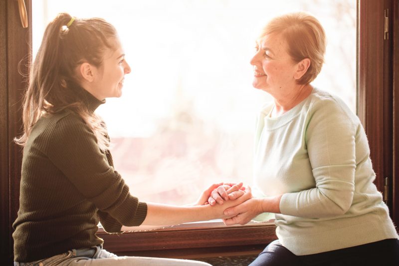 Smiling mother with young daughter